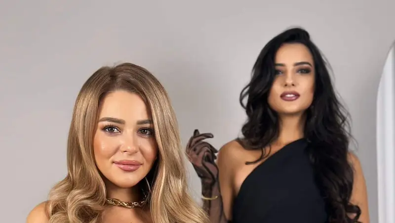 Two female singers in black dresses from an acoustic duo in Dubai
